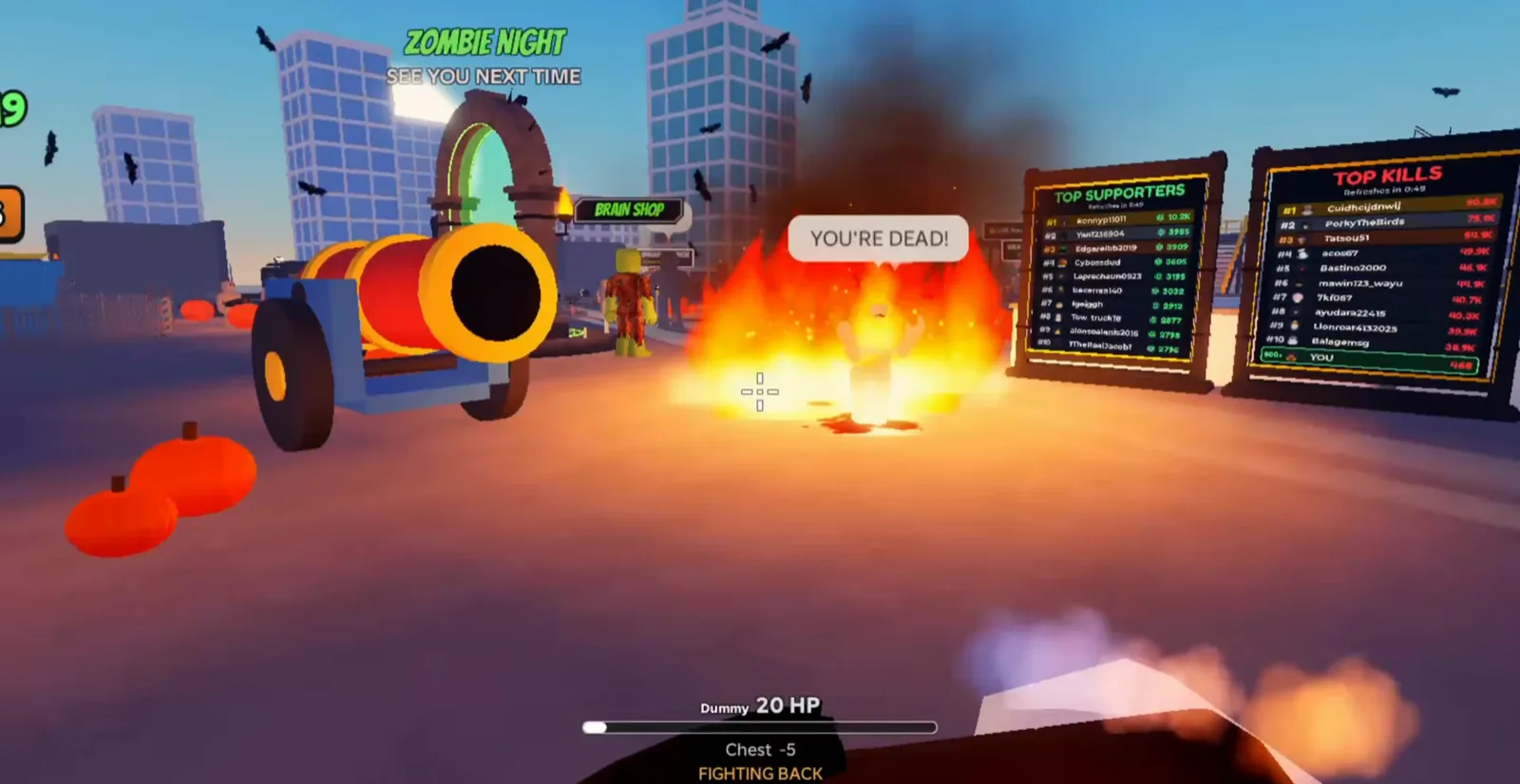 Ragdoll Reality Halloween plaza signage reads Zombie Night and Brain Shop beside pumpkins, fire, and dual leaderboard boards listing supporters and kills.